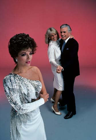 UNITED STATES - DECEMBER 17:  DYNASTY - "Gallery" 1983 Joan Collins, Linda Evans, John Forsythe  (Photo by Walt Disney Television via Getty Images Photo Archives/Walt Disney Television via Getty Images)