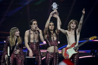 Italy's Maneskin celebrate on stage with the trophy after winning the final of the 65th edition of the Eurovision Song Contest 2021, at the Ahoy convention center in Rotterdam, on May 22, 2021. (Photo by Kenzo Tribouillard / AFP) (Photo by KENZO TRIBOUILLARD / AFP via Getty Images)