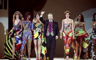 LOS ANGELES, CA - 1991:  Italian designer and toast of Paris, Miami and New York, Gianni Versace, takes a bow at a 1991 Los Angeles, California, fashion show. (Photo by George Rose/Getty Images)