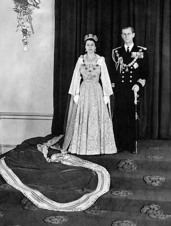 Queen Elizabeth II and Duke of Edinburgh, in the Throne Room of Buckingham Palace, London after they had returned from her first State Opening of Parliament.