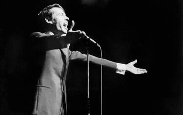 (FILES) - This file photo dated 07 October 1966 shows Belgian singer Jacques Brel singing for during his last show at Olympia music-hall in Paris. Jacques Brel died from a cancer 25 years ago, 09 October 1978 .    AFP PHOTO  (Photo credit should read -/AFP via Getty Images)