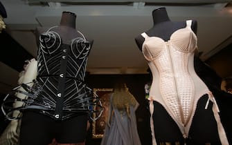 The clothes on display during a media view of 'The Fashion World of Jean Paul Gaultier: From the Sidewalk to the Catwalk' - the first major exhibition devoted to the celebrated French couturier, including costumes for film and performance including the conical bra and corsets Madonna wore during her 1990 Blond Ambition World Tour, stage costumes designed for Kylie Minogue as well as pieces created for the films of Pedro Almodovar among others - at Barbican Art Gallery in London.  (Photo by Yui Mok / PA Images via Getty Images)