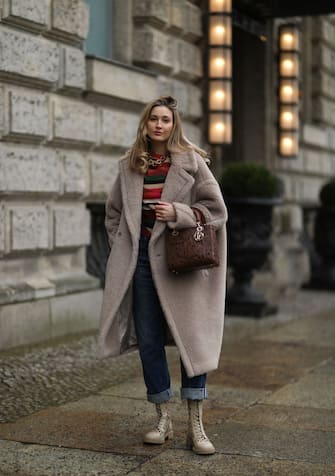 BERLIN, GERMANY - FEBRUARY 04: Mandy Bork wearing boots, sweater and bag Dior, Max Mara Teddy coat and Citizen of Humanity blue jeans on February 04, 2021 in Berlin, Germany. (Photo by Jeremy Moeller/Getty Images)