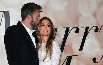 US actress Jennifer Lopez and actor Ben Affleck arrive for a special screening of "Marry Me" at the Directors Guild of America (DGA) in Los Angeles, February 8, 2022. (Photo by VALERIE MACON / AFP) (Photo by VALERIE MACON/AFP via Getty Images)