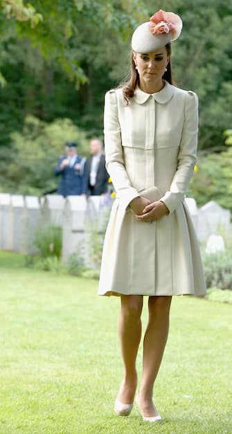 MONS, BELGIUM - AUGUST 04:  Catherine, Duchess of Cambridge looks at war graves at St Symphorien Military Cemetery on August 4, 2014 in Mons, Belgium. Monday 4th August marks the 100th Anniversary of Great Britain declaring war on Germany. In 1914 British Prime Minister Herbert Asquith announced at 11pm that Britain was to enter the war after Germany had violated Belgium's neutrality. The First World War or the Great War lasted until 11 November 1918 and is recognised as one of the deadliest historical conflicts with millions of casualties. A series of events commemorating the 100th Anniversary are taking place throughout the day.  (Photo by Chris Jackson/Getty Images)