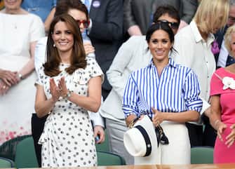 LONDON, ENGLAND - JULY 14:  Catherine, Duchess of Cambridge and Meghan, Duchess of Sussex attend day twelve of the Wimbledon Tennis Championships at the All England Lawn Tennis and Croquet Club on July 14, 2018 in London, England.  (Photo by Karwai Tang/WireImage )