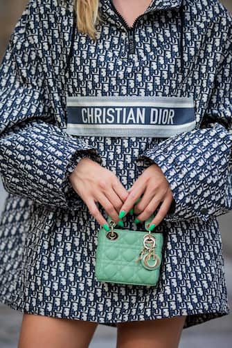 BERLIN, GERMANY - SEPTEMBER 07: Sonia Lyson is seen wearing Dior cape, Dior micro bag in green, Jimmy Choo boots, Dior sunglasses during Fashion Week Berlin on September 07, 2021 in Berlin, Germany.  (Photo by Christian Vierig / Getty Images)