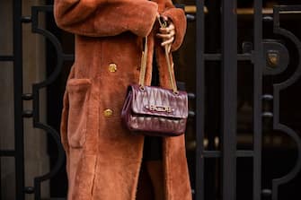 MILAN, ITALY - SEPTEMBER 26: Leonie Hanne seen wearing bordeaux bag and boots, coat outside Bally during the Milan Women's Fashion Week on September 26, 2020 in Milan, Italy. (Photo by Christian Vierig/Getty Images)