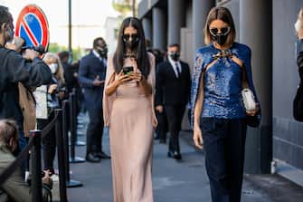 MILAN, ITALY - SEPTEMBER 27: Gilda Ambrosio seen wearing dress and Giorgia Tordini wearing blue top, navy pants outside Valentino during the Milan Women's Fashion Week on September 27, 2020 in Milan, Italy. (Photo by Christian Vierig/Getty Images)