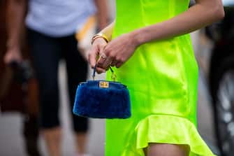 MILAN, ITALY - SEPTEMBER 19: Jaime Xie seen wearing green asymmetric neon dress, blue mini Fendi bag outside the Fendi show during Milan Fashion Week Spring/Summer 2020 on September 19, 2019 in Milan, Italy. (Photo by Christian Vierig/Getty Images)