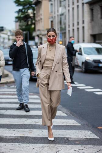 MILAN, ITALY - SEPTEMBER 25: Olivia Palermo seen wearing face mask, beige turtleneck, blazer and pants, white heels, necklace outside Boss during the Milan Women's Fashion Week on September 25, 2020 in Milan, Italy. (Photo by Christian Vierig/Getty Images)