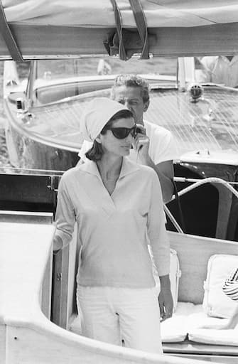 Jackie Kennedy is shown at the Pier of Amalfi, en route to Conca dei Marini beach via motorboat and then back from Amalfi to Ravello Villa.