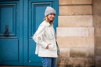 PARIS, FRANCE - JANUARY 22: Lisa Aiken, wearing a white t-shirt, blue jeans, white fringed jacket, grey hat and white bag, is seen outside Alexis Mabille show during Paris Fashion Week - Haute Couture Spring Summer 2019 on January 22, 2019 in Paris, France. (Photo by Claudio Lavenia/Getty Images)