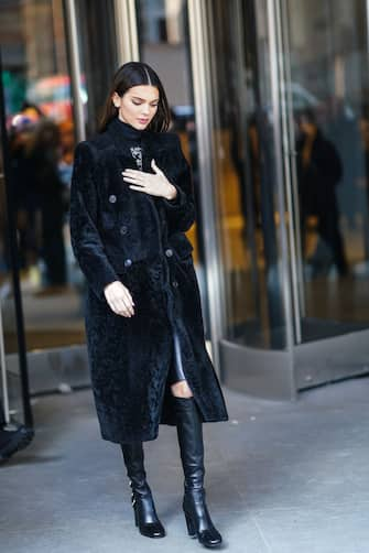 NEW YORK, NEW YORK - FEBRUARY 08: Kendall Jenner wears a turtleneck pullover, a black fluffy long coat, outside Longchamp, during New York Fashion Week Fall-Winter 2020, on February 08, 2020 in New York City. (Photo by Edward Berthelot/Getty Images)