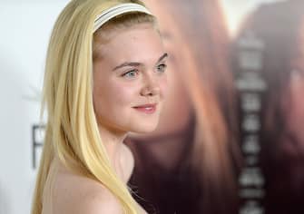 HOLLYWOOD, CA - NOVEMBER 07: Actress Elle Fanning arrives at the "Ginger And Rosa" special screening during AFI Fest 2012 presented by Audi at Grauman's Chinese Theatre on November 7, 2012 in Hollywood, California.  (Photo by Jason Merritt/Getty Images)