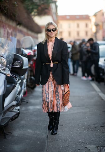 MILAN, ITALY - JANUARY 12: Caroline Daur is seen wearing belted blazer, salmon colored dress with graphic print outside Marni during Milan Menswear Fashion Week Autumn/Winter 2019/20 on January 12, 2019 in Milan, Italy. (Photo by Christian Vierig/Getty Images)