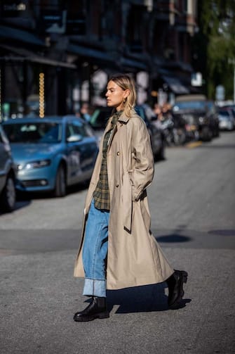 COPENHAGEN, DENMARK - AUGUST 12: Alessa Winter seen wearing denim jeans, trench coat in beige, black boots Copenhagen Studios on August 12, 2021 in Copenhagen, Denmark. (Photo by Christian Vierig/Getty Images)