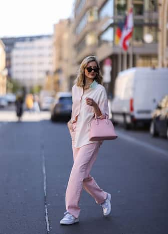 BERLIN, GERMANY - APRIL 27: Mandy Bork wearing pink Zara jeans, pink Bonaventura leather bag, Storets flanell, Nike sneakers and Bottega Veneta shades on April 27, 2021 in Berlin, Germany. (Photo by Jeremy Moeller/Getty Images)