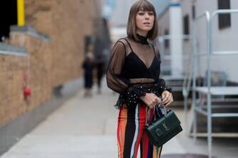 NEW YORK, NY - SEPTEMBER 09: A guest wearing a sheer top, YSL bag seen in the streets of Manhattan outside Jonathan Simkhai during New York Fashion Week on September 9, 2017 in New York City. (Photo by Christian Vierig/Getty Images)