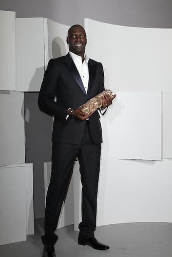 PARIS, FRANCE - FEBRUARY 24:  Actor Omar Sy poses in the Awards Room during the 37th Cesar Film Awards at Theatre du Chatelet on February 24, 2012 in Paris, France.  (Photo by Marc Piasecki/Getty Images)