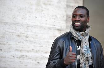 French actor Omar Sy poses during the photocall of the movie ''De l'autre cote du periph'' in Rome on March 21, 2013.  AFP PHOTO / TIZIANA FABI        (Photo credit should read TIZIANA FABI/AFP via Getty Images)