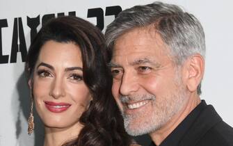 1149317746 LONDON, ENGLAND - MAY 15: Amal Clooney and George Clooney attend the "Catch 22" UK premiere on May 15, 2019 in London, United Kingdom. (Photo by Stuart C. Wilson/Getty Images)