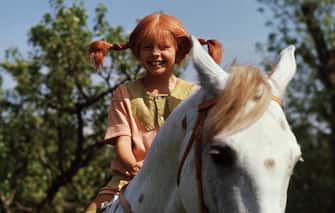 TO GO WITH AFP STORY BY DELPHINE TOUITOU (FILES) A file photo taken 01 May 1969 shows a still from the movie "Pippi Longstocking" with Inger Nilsson as Pippi on her horse, Little Gubben. Swedish writer Astrid Lindgren, who would have been 100 14 November 2007, still enjoys worldwide success with her children's books, which like her most famous character Pippi Longstocking do not seem to have aged a bit. Born 14 November 1907 in the southeastern Swedish town of Vimmerby, the writer revolutionized the world of children's books with such beloved characters as Emil of Maple Hill, Madicken, Karlsson-on-the Roof and Ronia the Robber's Daughter.  AFP PHOTO / Pressens Bild (Photo credit should read Pressens Bild/AFP via Getty Images)