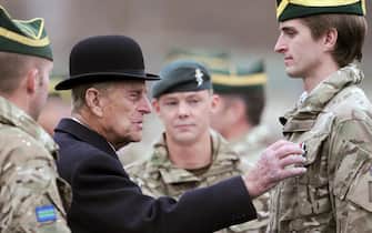 Britain's Prince Philip, Duke of Edinburgh (2-L) visits the tank regiment of the Queen's Royal Hussars in Paderborn, Germany, 19??November 2014. The British royal awarded soldiers who just returned back from south Afghanistan for their service. ANSA/CAROLINE??SEIDEL