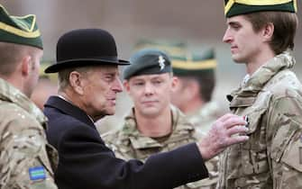 Britain's Prince Philip, Duke of Edinburgh (2-L) visits the tank regiment of the Queen's Royal Hussars in Paderborn, Germany, 19??November 2014. The British royal awarded soldiers who just returned back from south Afghanistan for their service.  ANSA/CAROLINE??SEIDEL