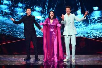 (From L) Italian television presenter Alessandro Cattelan, Italian singer Laura Pausini and Lebanese-born British singer-songwriter, Mika cheer the audience during the first semifinal of the Eurovision Song contest 2022 on May 10, 2022 at the Palalpitour venue in Turin. (Photo by Marco BERTORELLO / AFP) (Photo by MARCO BERTORELLO/AFP via Getty Images)