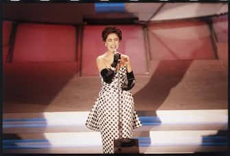 Italian singer Mia Martini (Domenica BertÃ©) performing on the stage of the Ariston Theatre during the 39th Sanremo Music Festival. Sanremo, February 1989 (Photo by Angelo Deligio/Mondadori via Getty Images)