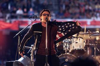 U2 singer Bono performing on the Super Bowl XXXVI - Halftime Show at the Louisiana Superdome in New Orleans, LA., 2/3/02. Photo by Frank Micelotta/Getty Images.