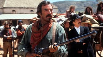 Tom Selleck holds a rifle in a scene from the film 'Quigley Down Under', 1990. (Photo by Metro-Goldwyn-Mayer/Getty Images)