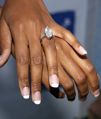 51203212 LOS ANGELES, CA - AUGUST 21: Actress Traci Bingham displays her engagement ring at Project Angel Food's 11th Annual Angel Awards Gala at Project Angel Food Headquarters on August 21, 2004 in Los Angeles, California. (Photo by Stephen Shugerman/Getty Images)