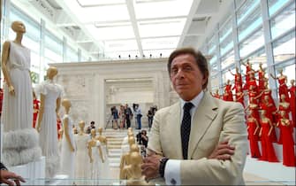 ITALY - JULY 06:  Italian fashion designer Valentino celebrates 45 years of activity :exhibition at the Ara Pacis Museum in Rome. Rome rolled out the red carpet to welcome back Valentino Garavani, decking out a historic museum with his sweeping gowns. "I am filled with emotion," Valentino said at the opening of his retrospective in the modern, marble-and-glass venue designed by the American architect Richard Meier.The exhibit, set up by Patrick Kinmonth and Antonio Monfreda, includes more than 200 outfits, as well as shoes and accessories. One room is lined with dresses worn by famous clients, each accompanied by a video showing when and how the dress was worn.Valentino Garavani in Rome, Italy on July 06, 2007  (Photo by Eric VANDEVILLE/Gamma-Rapho via Getty Images)