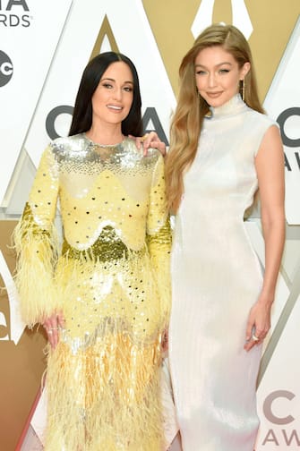 NASHVILLE, TENNESSEE - NOVEMBER 13: (FOR EDITORIAL USE ONLY) Kacey Musgraves and Gigi Hadid attend the 53rd annual CMA Awards at the Music City Center on November 13, 2019 in Nashville, Tennessee.  (Photo by John Shearer / WireImage,)
