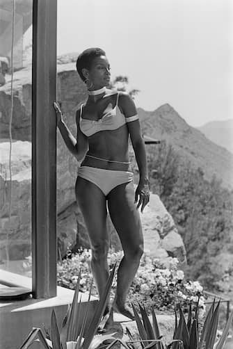 Actress Trina Parks on the set of the James Bond film 'Diamonds Are Forever', USA, 1971. She is on location at the Elrod House in Palm Springs, California. (Photo by Anwar Hussein/Getty Images)