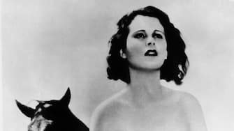 1932:  Austrian-born actor Hedy Lamarr (1913-2000), then known as Hedwig Kiesler, stands in front of a horse in the nude scene from Czech director Gustav Machaty's film, 'Extase (Ecstasy)'.  (Photo by Hulton Archive/Getty Images)
