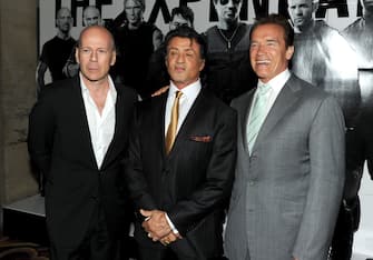 HOLLYWOOD - AUGUST 03:  Actor Bruce Willis, director/writer/actor Sylvester Stallone and California Governor Arnold Schwarzenegger arrive at the premiere of Lionsgate Films' "The Expendables" at Grauman's Chinese Theatre on August 3, 2010 in Hollywood, California.  (Photo by Kevin Winter/Getty Images)