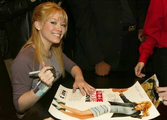 Hilary Duff with one of her The Lizzie McGuire Movie posters (Photo by Jim Spellman/WireImage)