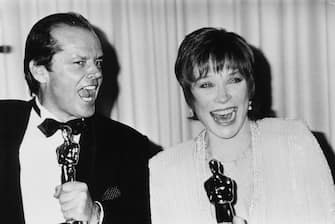 Actors Jack Nicholson and Shirley MacLaine joking around with their Oscar statuettes, which they both won for the film 'Terms of Endearment', at the 56th Academy Awards, Los Angeles, April 9th 1984. (Photo by Fotos International/Archive Photos/Getty Images)