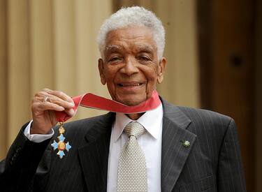 LONDON - MAY 28: Actor Earl Cameron poses outside Buckingham Palace with his CBE, presented by the Prince of Wales on May 28, 2009 in London, England. (Photo by Anthony Devlin/WPA Pool/Getty Images)