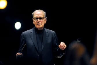 RIMINI, ITALY - AUGUST 25:  Italian composer Ennio Morricone conducts the choir and orchestra in concert "la Bellezza ci salvera"  on August 25, 2012 in Rimini, Italy.  (Photo by Roberto Serra - Iguana Press/Getty Images)