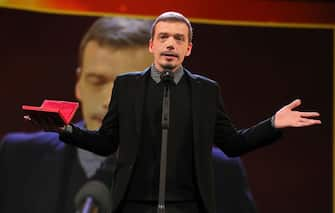 BERLIN, GERMANY - FEBRUARY 29: Cristi Puiu winner of the Best Director in the 'Encounters' Competition for the movie 'Malmkrog' on stage at the closing ceremony of the 70th Berlinale International Film Festival Berlin at Berlinale Palace on February 29, 2020 in Berlin, Germany. (Photo by Andreas Rentz/Getty Images)