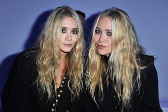 PARIS, FRANCE - OCTOBER 01:  Mary-Kate Olsen and Ashley Olsen attend the Dw by Kanye West Ready to Wear Spring / Summer 2012 show during Paris Fashion Week at Lycee Henri IV on October 1, 2011 in Paris, France.  (Photo by Pascal Le Segretain/Getty Images)