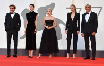 Director of the Venice Film festival, Alberto Barbera (R) greets (From L) US actor Christopher Abbott, US British actress Katherine Waterston, Norwegian director Mona Fastvold and British actress Vanessa Kirby as they arrive for the screening the film "The World to Come" presented in competition on the fifth day of the 77th Venice Film Festival, on September 6, 2020 at Venice Lido, during the COVID-19 infection, caused by the novel coronavirus. (Photo by Tiziana FABI / AFP) (Photo by TIZIANA FABI/AFP via Getty Images)
