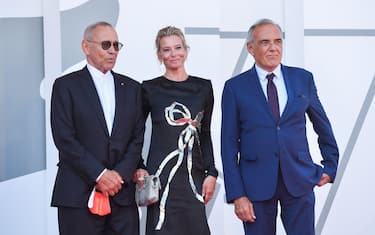 Director of the Venice Film festival, Alberto Barbera (R) greets Russian director Andrei Konchalovsky and Russian actress Julia Vysotskaya as they arrive for the screening of the film "Dorogie Tovarischi! (Dear Comrades!)" presented in competition on the sixth day of the 77th Venice Film Festival, on September 7, 2020 at Venice Lido, during the COVID-19 infection, caused by the novel coronavirus. (Photo by Tiziana FABI / AFP) (Photo by TIZIANA FABI/AFP via Getty Images)