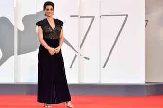 1228425637 Italian actress Donatella Finocchiaro arrives for the screening of the film "Le Sorelle Macaluso" presented in competition on the eighth day of the 77th Venice Film Festival, on September 9 , 2020 at Venice Lido, during the COVID-19 infection, caused by the novel coronavirus. (Photo by Tiziana FABI / AFP) (Photo by TIZIANA FABI/AFP via Getty Images)