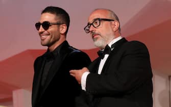 VENICE, ITALY - SEPTEMBER 11: Miguel Ángel Silvestre and Director Álex de la Iglesia walk the red carpet ahead of the movie "30 Monedas" (30 Coins) - Episode 1 at the 77th Venice Film Festival on September 11, 2020 in Venice, Italy. (Photo by Elisabetta Villa/Getty Images)
