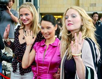 US actress Cameron Diaz (L), Lucy Liu (C) and Drew Barrymore (R) wave to photographers upon their arrival at a press conference in Tokyo 02 June 2003. The three actresses are here to promote their new movie "Charlie's Angels" which will be shown from 28 June all over Japan.          AFP PHOTO/Toru YAMANAKA  (Photo credit should read TORU YAMANAKA/AFP via Getty Images)